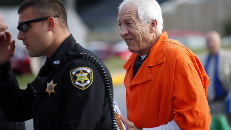 Jerry Sandusky being escorted to court