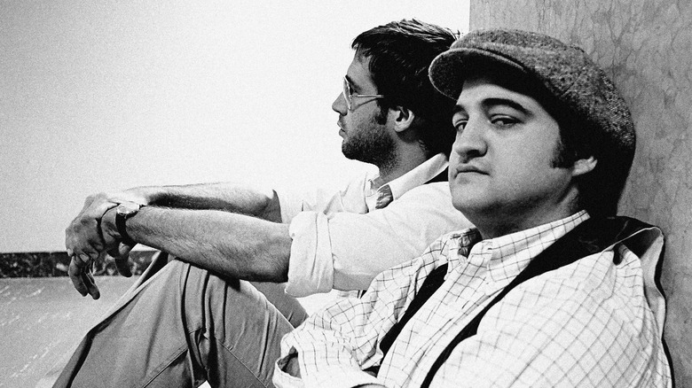 Chevy Chase and John Belushi sitting backstage at Saturday Night Live