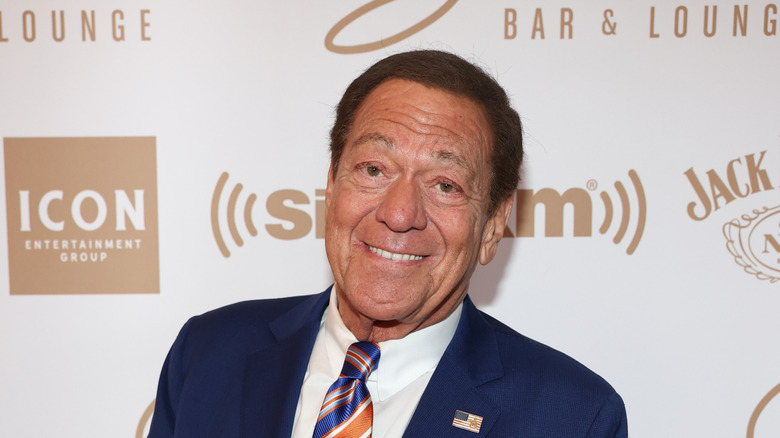 Joe Piscopo posing on a red carpet in 2023