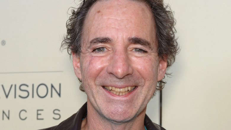 harry shearer smiling big leather jacket