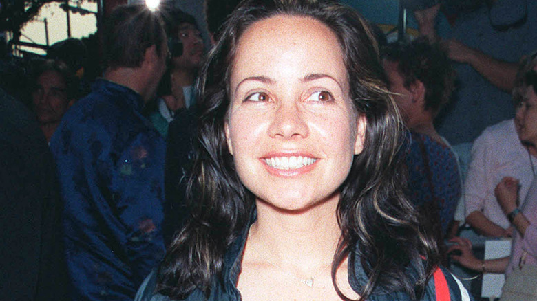 janeane garofalo looking sideways smiling