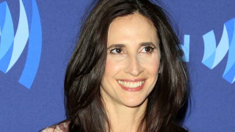 michaela watkins looking to side smiling