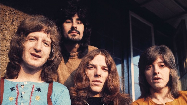 Four members of Badfinger long hair looking forward