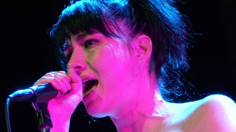 Kathleen Hanna performing with Le Tigre