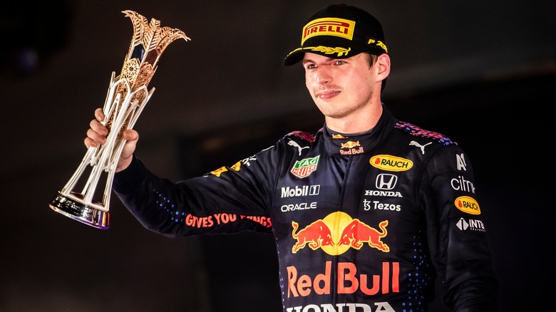 Max Verstappen holds trophy