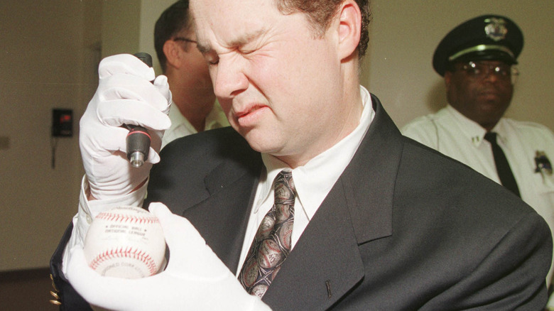 Auctioneer authenticating Mark McGwire's 70th home run ball