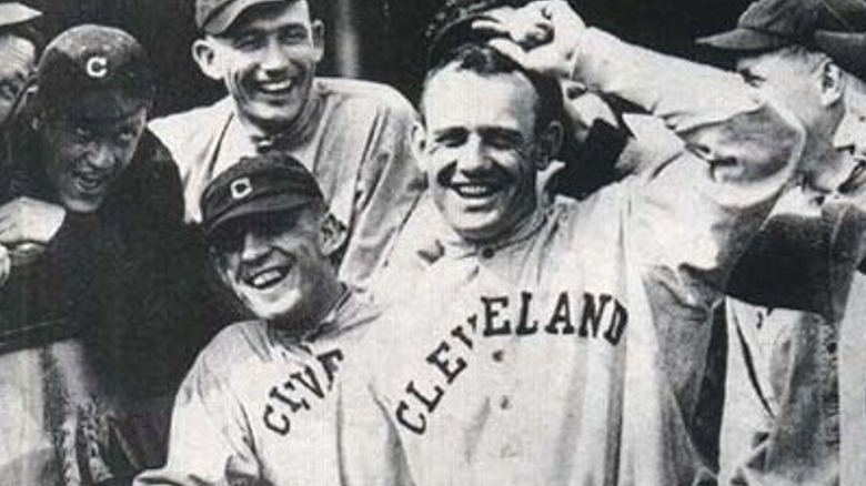 Raymond Chapman putting on baseball hat