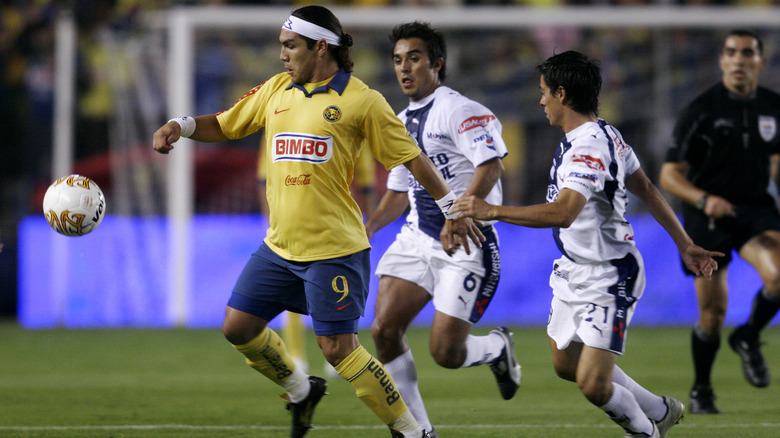An action shot of a Cabanas v. CF Pachuca match