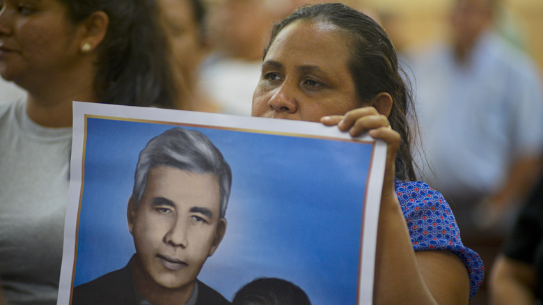 Woman With Rutilio Grande Poster