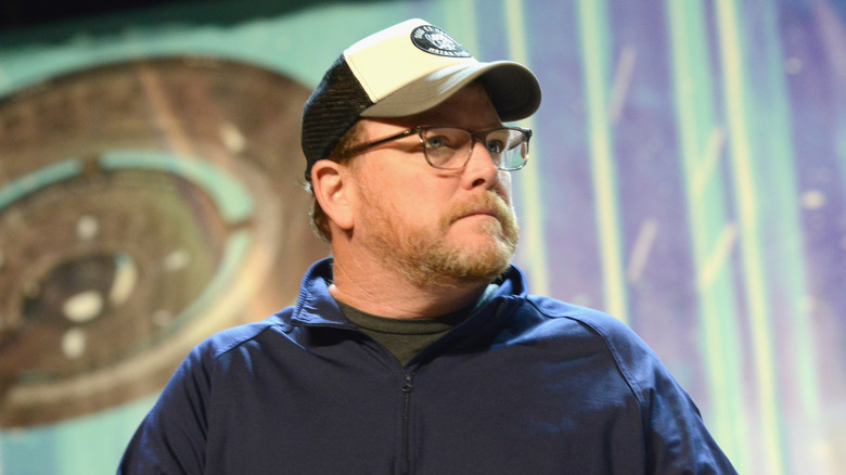 Robert Duncan McNeill holding microphone at a panel