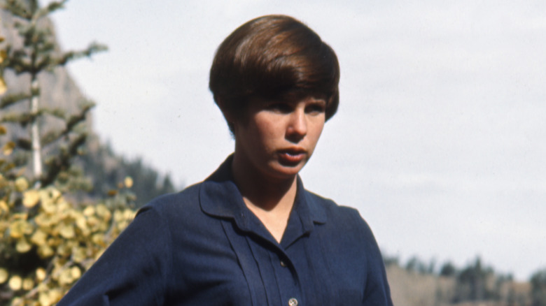 Kim Darby short hair squinting blue dress