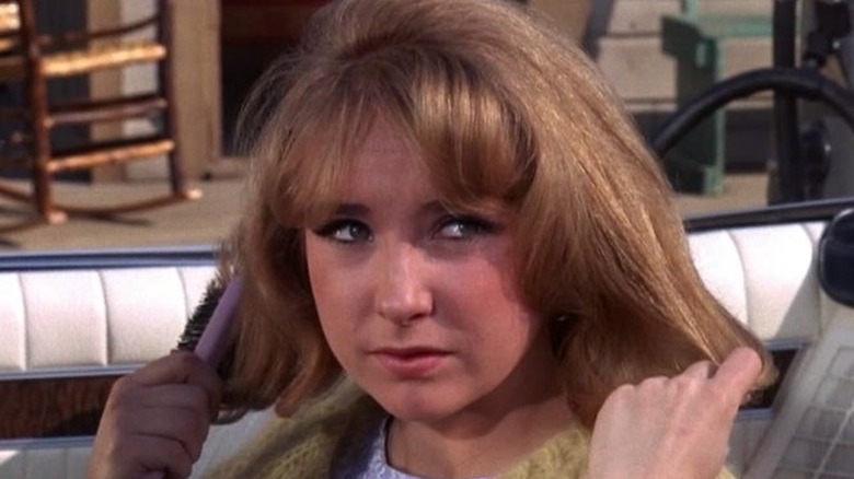 Teri Garr smirking brushing hair