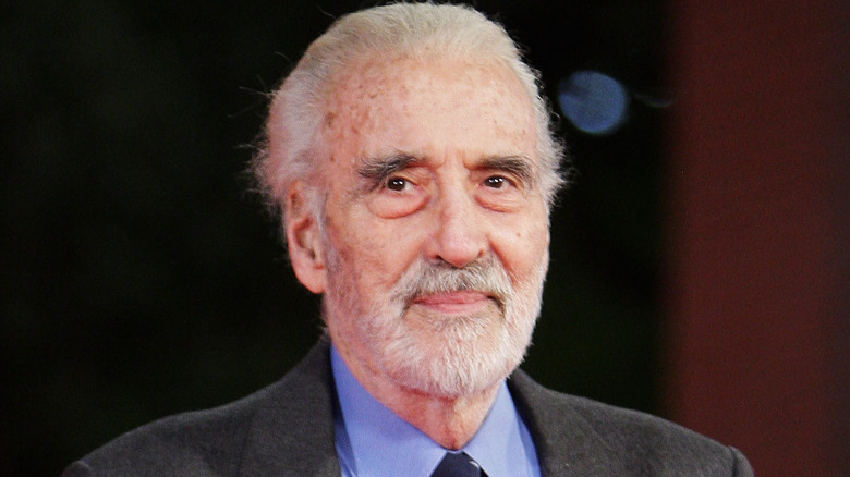 christopher lee grey beard suit smiling