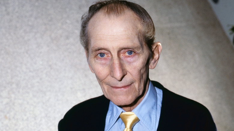 peter cushing suit tie smiling