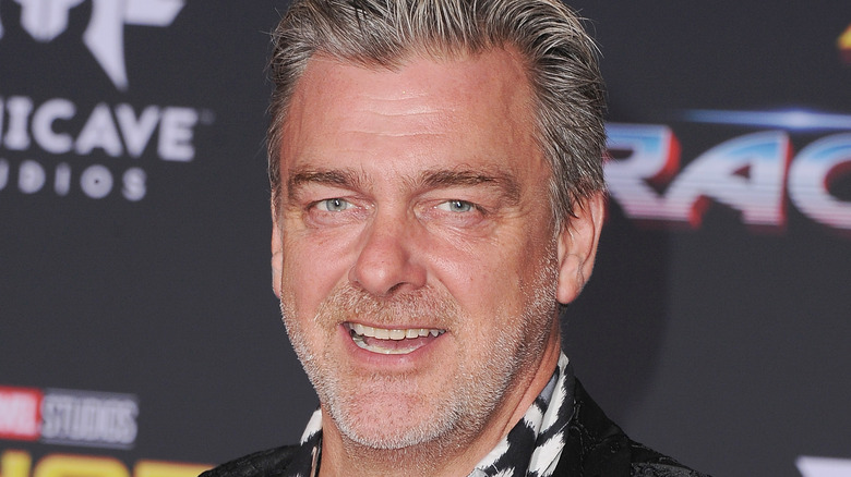 ray stevenson smiling at event stubble