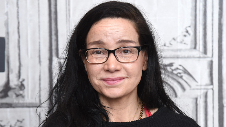 janeane garofalo wincing at camera glasses