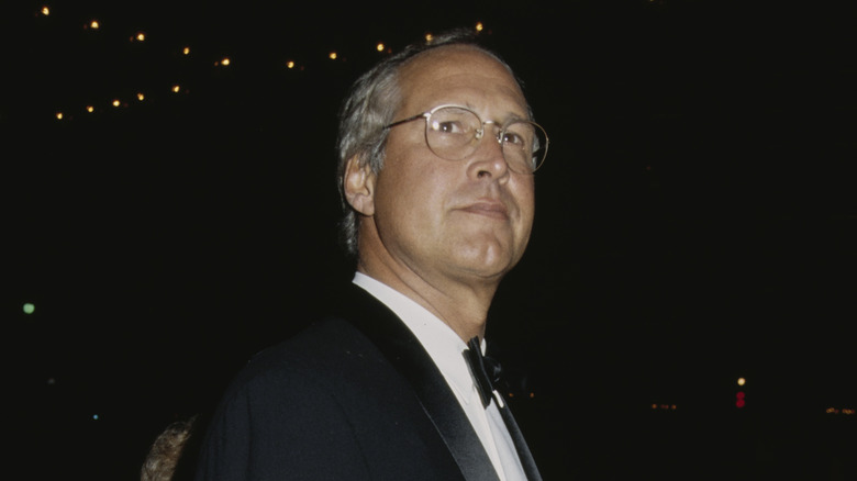 Chevy Chase wearing glasses tuxedo