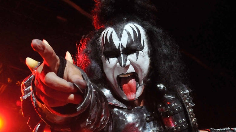 gene simmons kiss makeup tongue out pointing