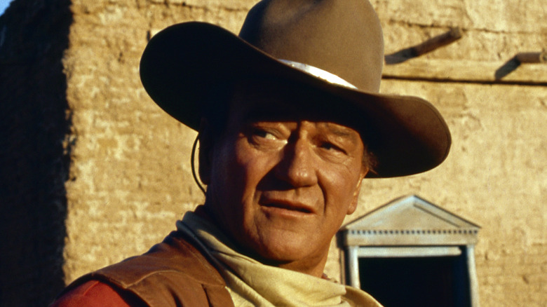 john wayne in western cowboy hat and dress