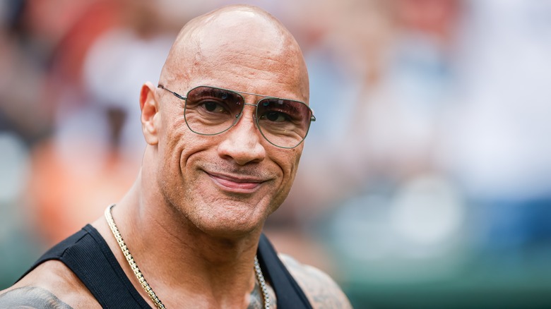 Dwayne Johnson in a tank top and chain