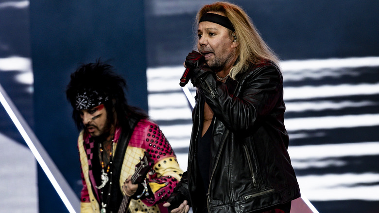 Nikki Sixx and Vince Neil on stage