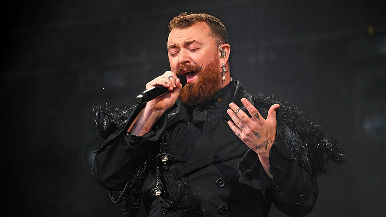 Sam Smith singing into a microphone