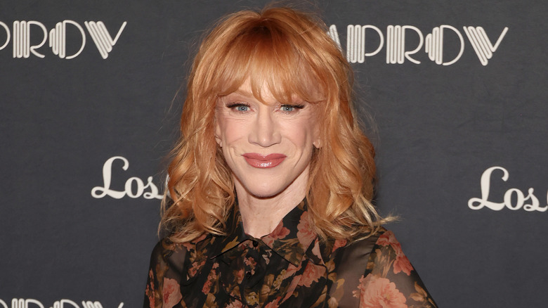 Kathy Griffin wearing a floral blouse and smiling