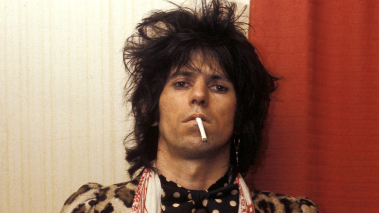 Keith Richards staring ahead cigarette dangling from mouth