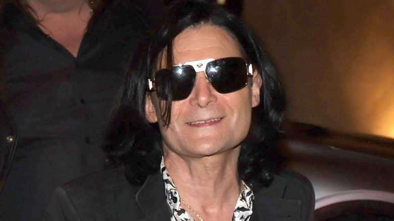 corey feldman smiling at camera sunglasses