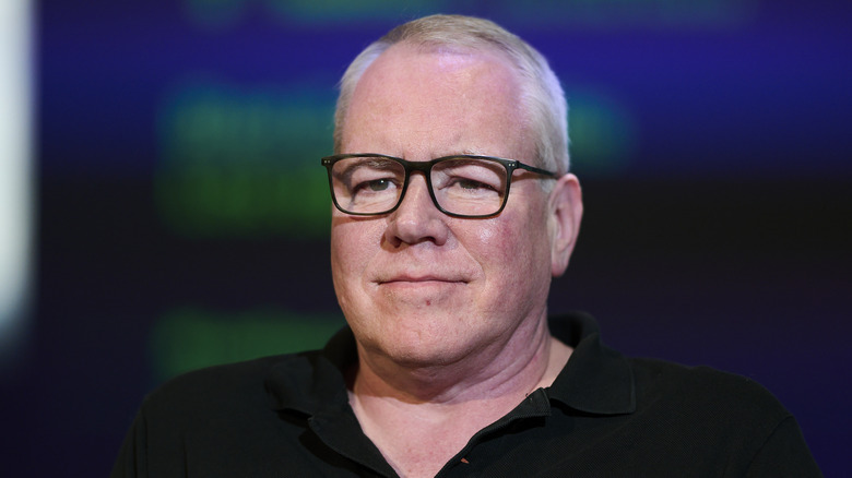 Bret Easton Ellis glasses black shirt looking ahead