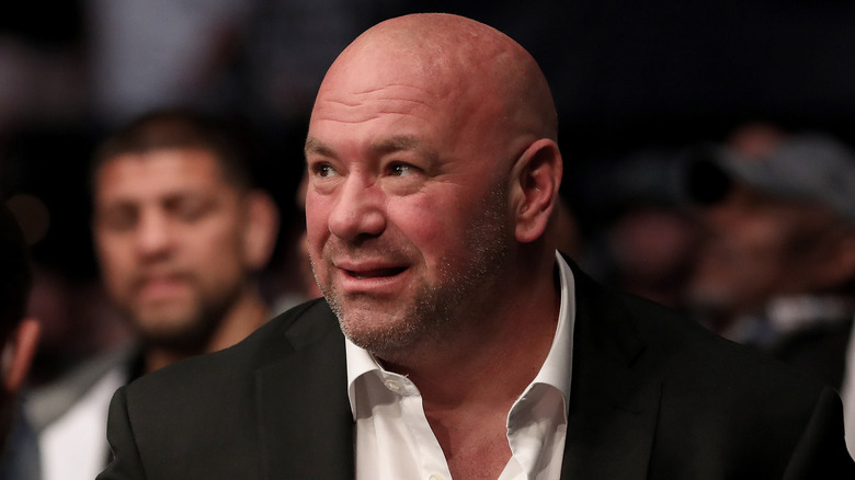 Dana White suit looking right grimacing