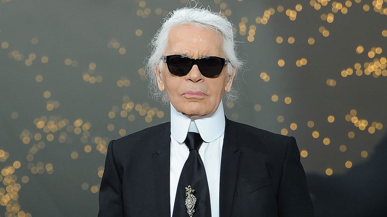 Karl Lagerfeld black suit white hair sunglasses