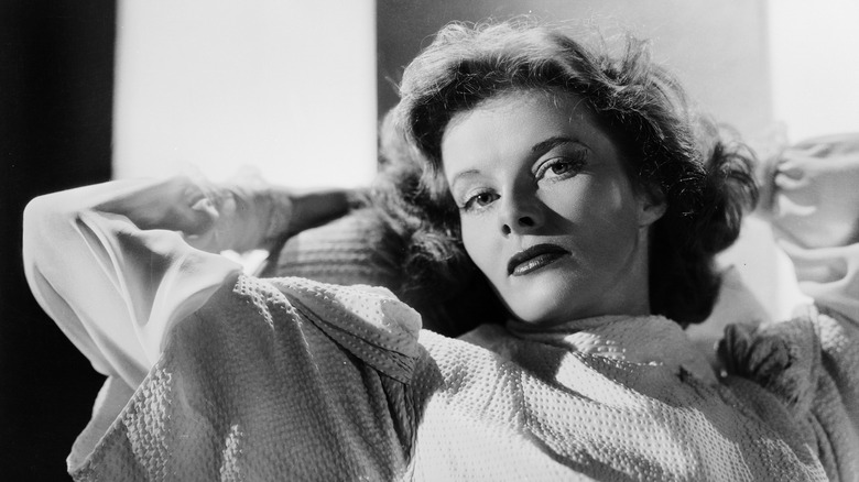 Katharine Hepburn leaning arms behind head