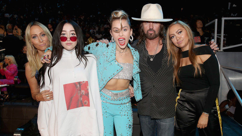 The Cyrus family posing for a photo together