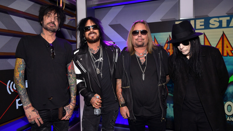 Motley Crue pose at press conference in 2019