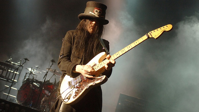 Mick Mars playing guitar