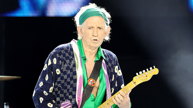 Keith Richards playing guitar onstage