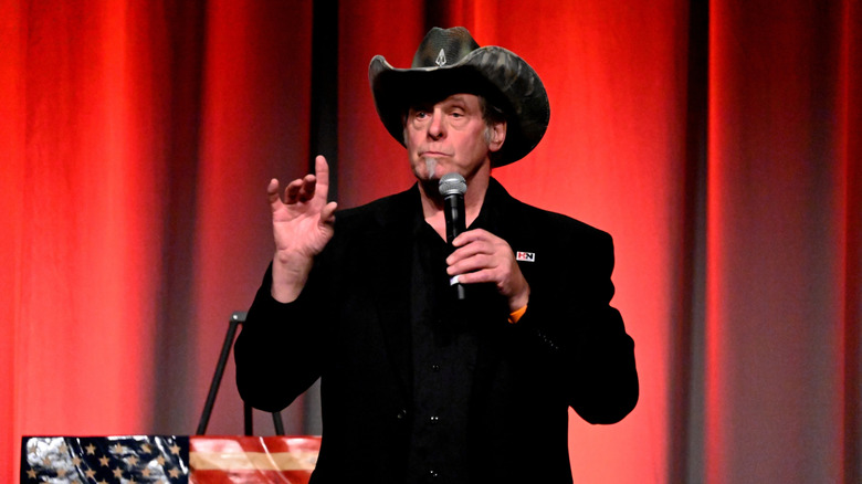 Ted Nugent in cowboy hat with microphone onstage