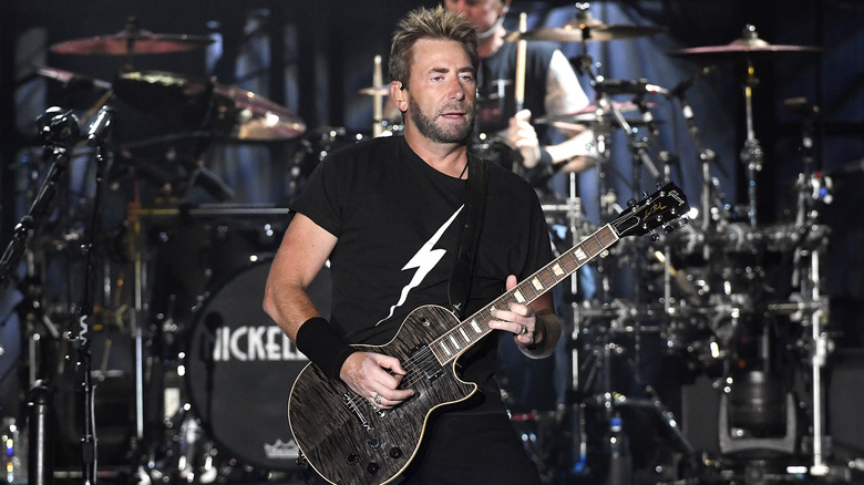 Chad Kroeger playing guitar onstage