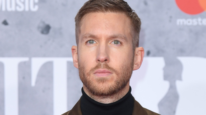 calvin harris beard staring off serious