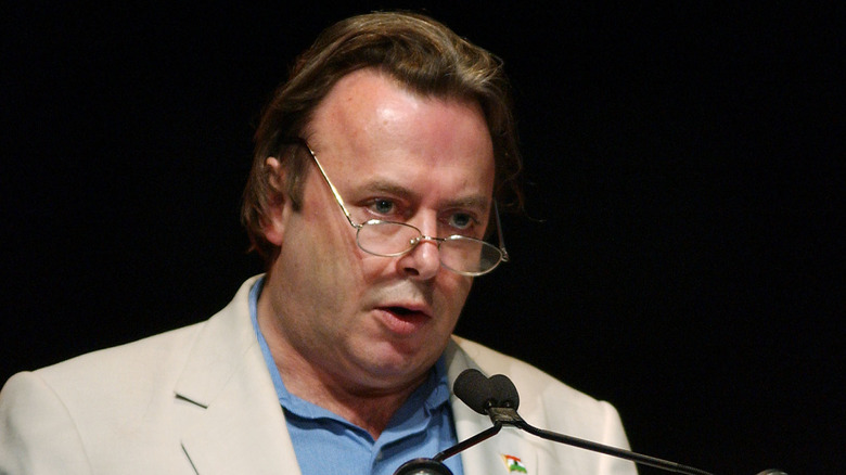 Christopher Hitchens looks over glasses