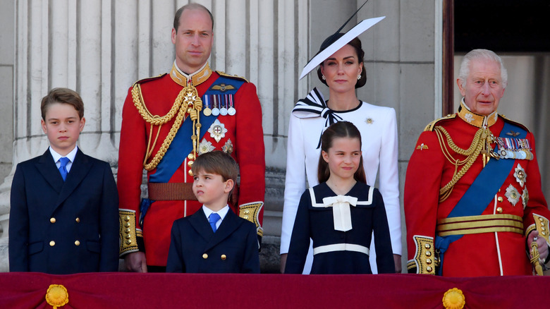 Royal family stand at balcony