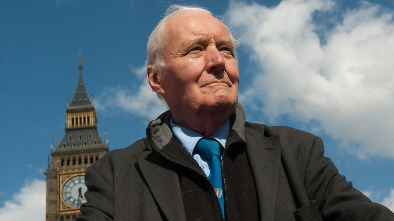 Tony Benn stands before Big Ben