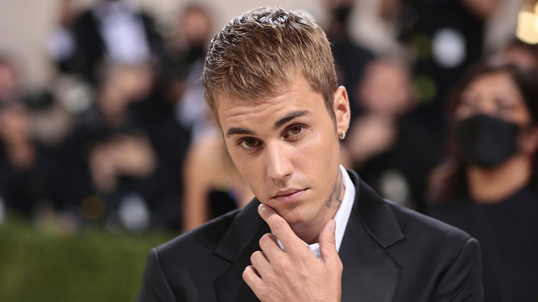 Justin Bieber posing thoughtfully at the Met Gala