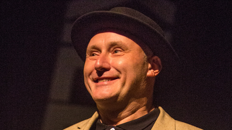 jah wobble hat grinning