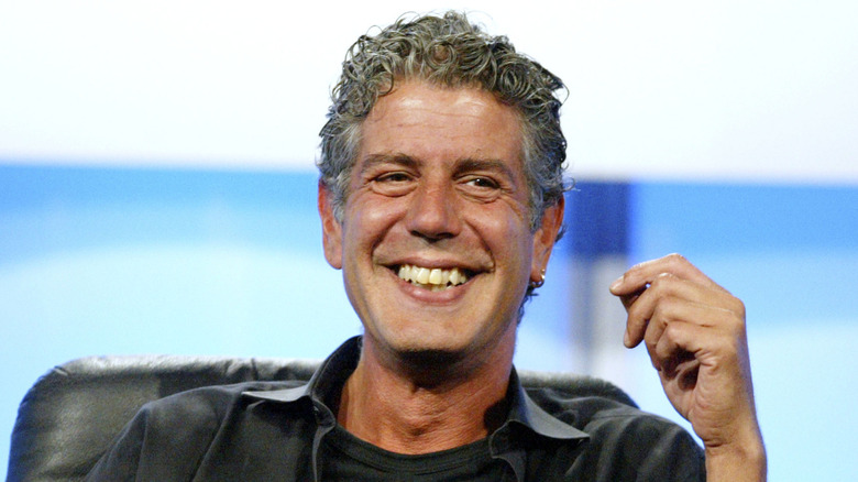 Anthony Bourdain laughing during a panel talk