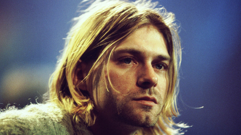 Kurt Cobain, wearing a sweater, looks forlorn during MTV Unplugged taping.