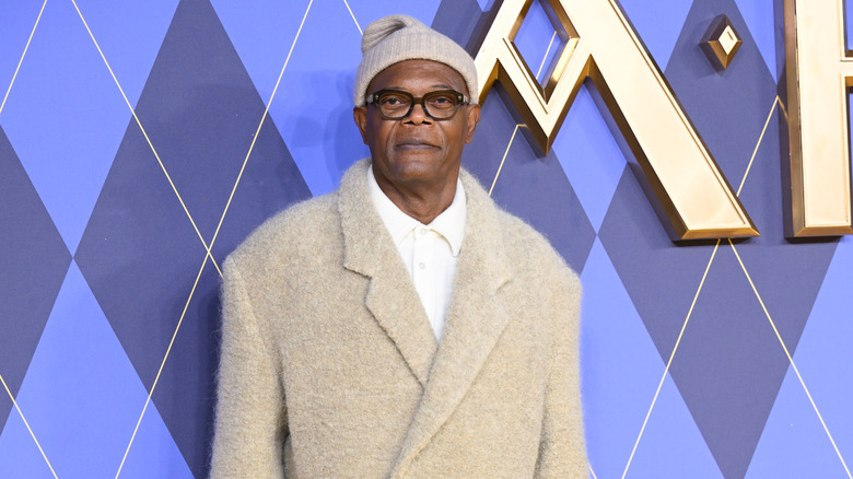 Samuel L. Jackson wearing a beanie, glasses, and coat