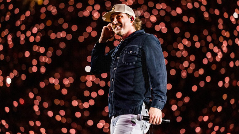 Morgan Wallen smiling  on stage