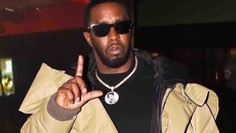 Sean Diddy Combs making L sign